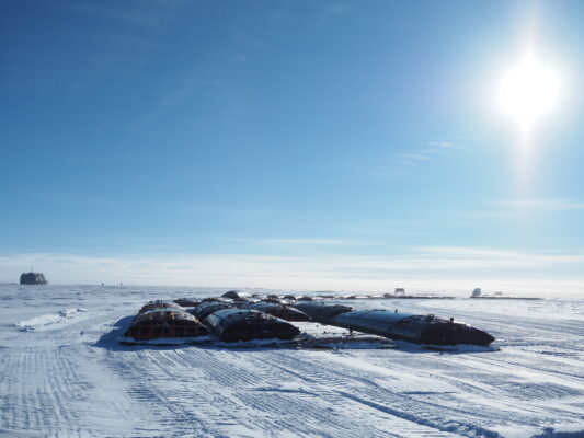 Large fuel bladders parked on the ice at the South Pole.]