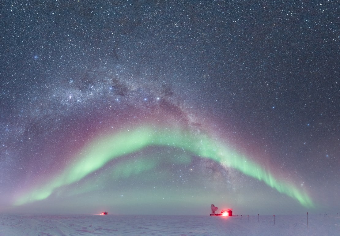 An archway of auroras over the IceCube Lab and the South Pole Telescope.