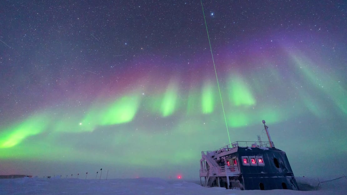 View of the LIDAR at the ARO building, with auroras overhead.