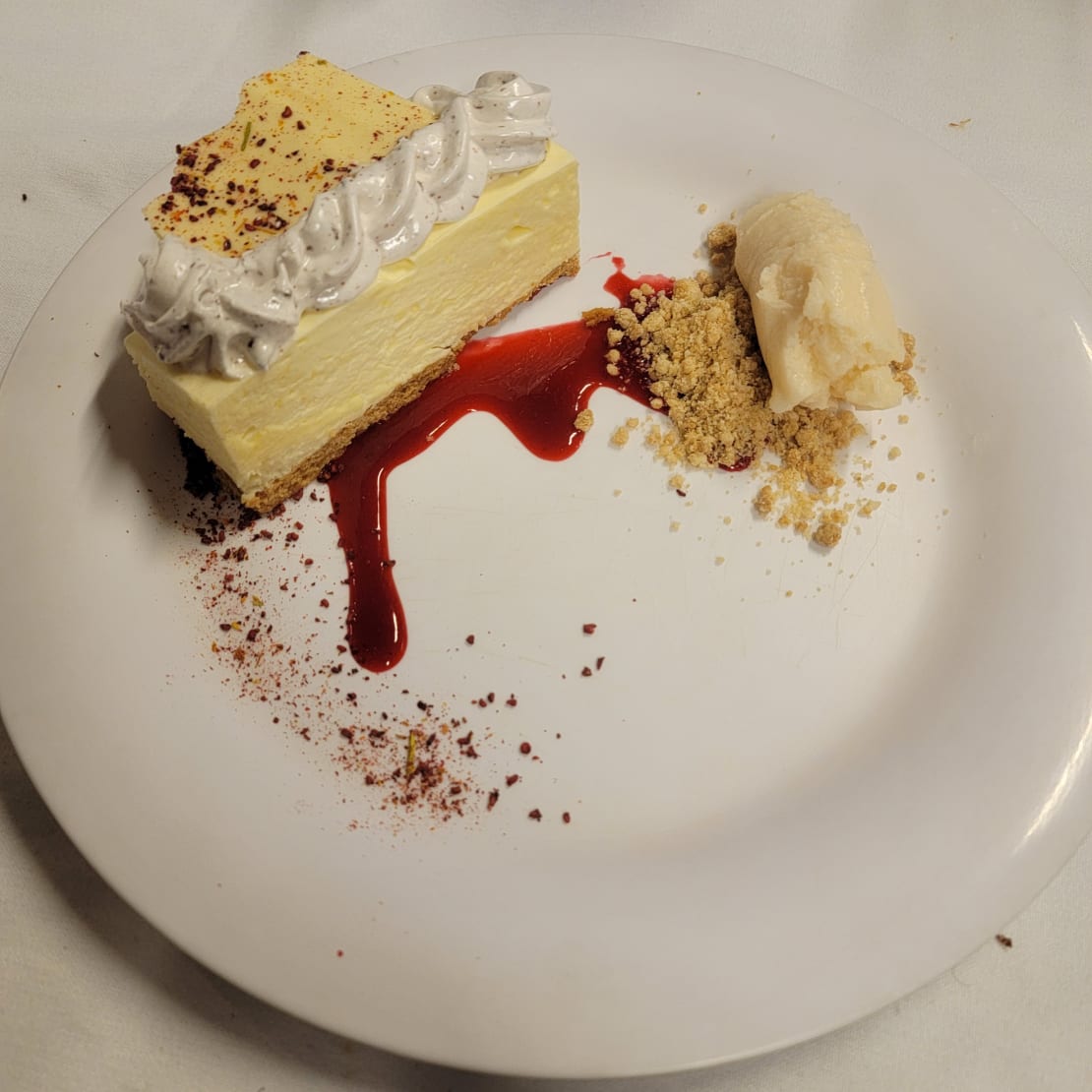 Close-up of fancy dessert on white plate.