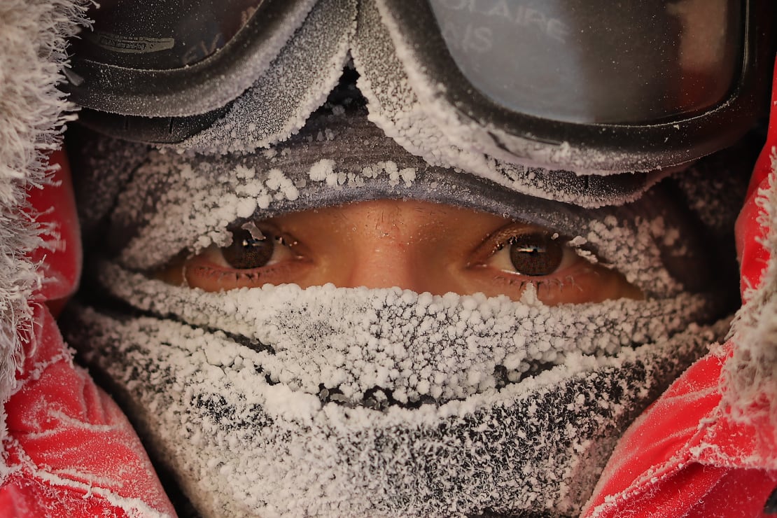 Close-up of covered frosted face mask, just eyes showing.