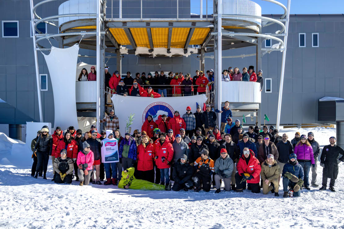 Group photo outside in front of South Pole station entrance.