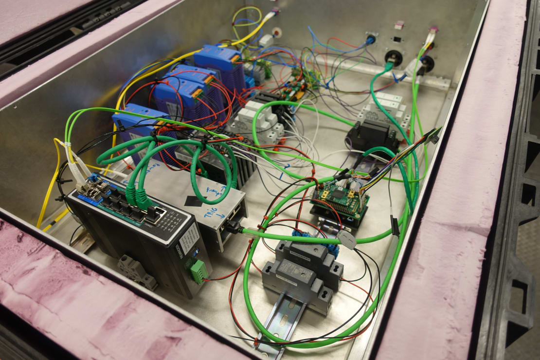 Close up view inside computer box showing components and wiring.