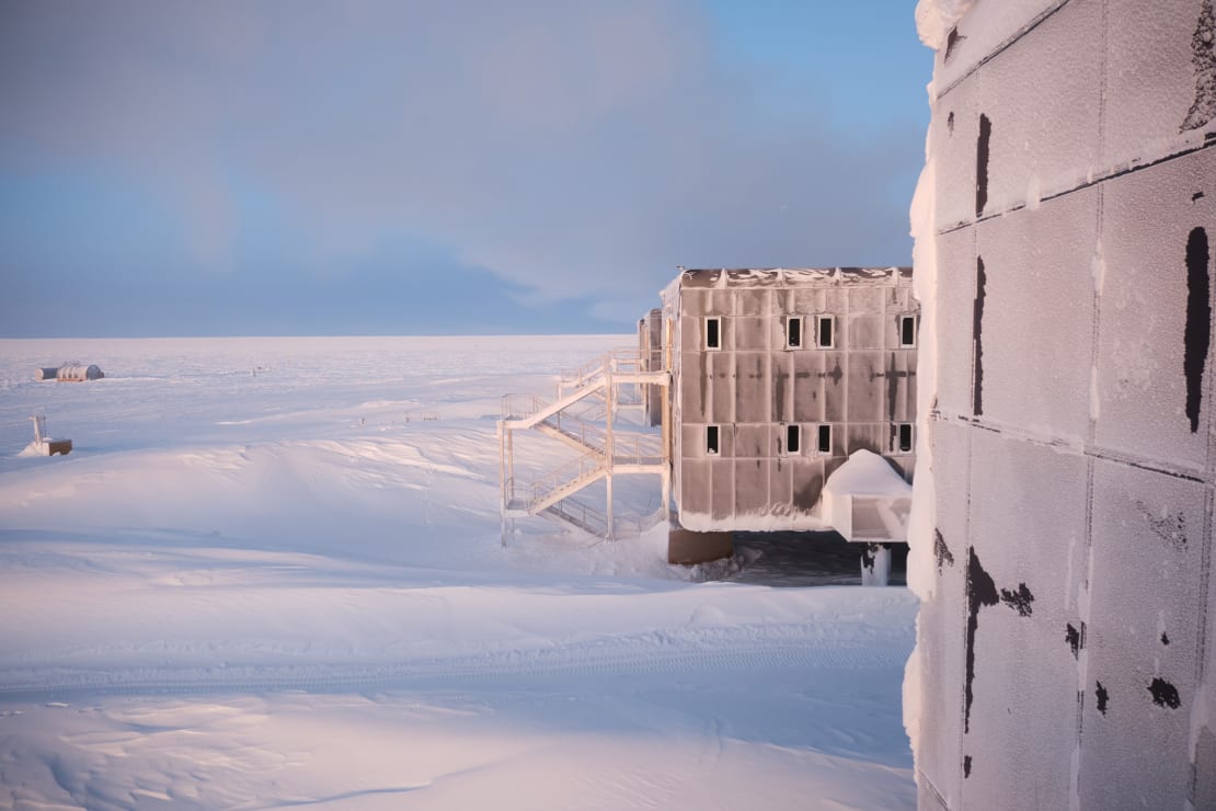 Snowdrifts shown in sideview of the back of the South Pole station.