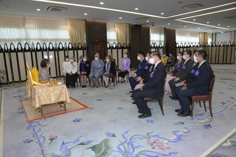 The princess of Thailand sitting in front of delegates in chairs