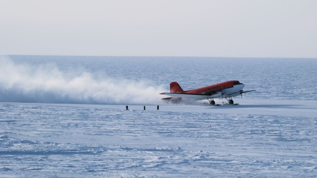 A small plane on the ice just upon landing at the South Pole.