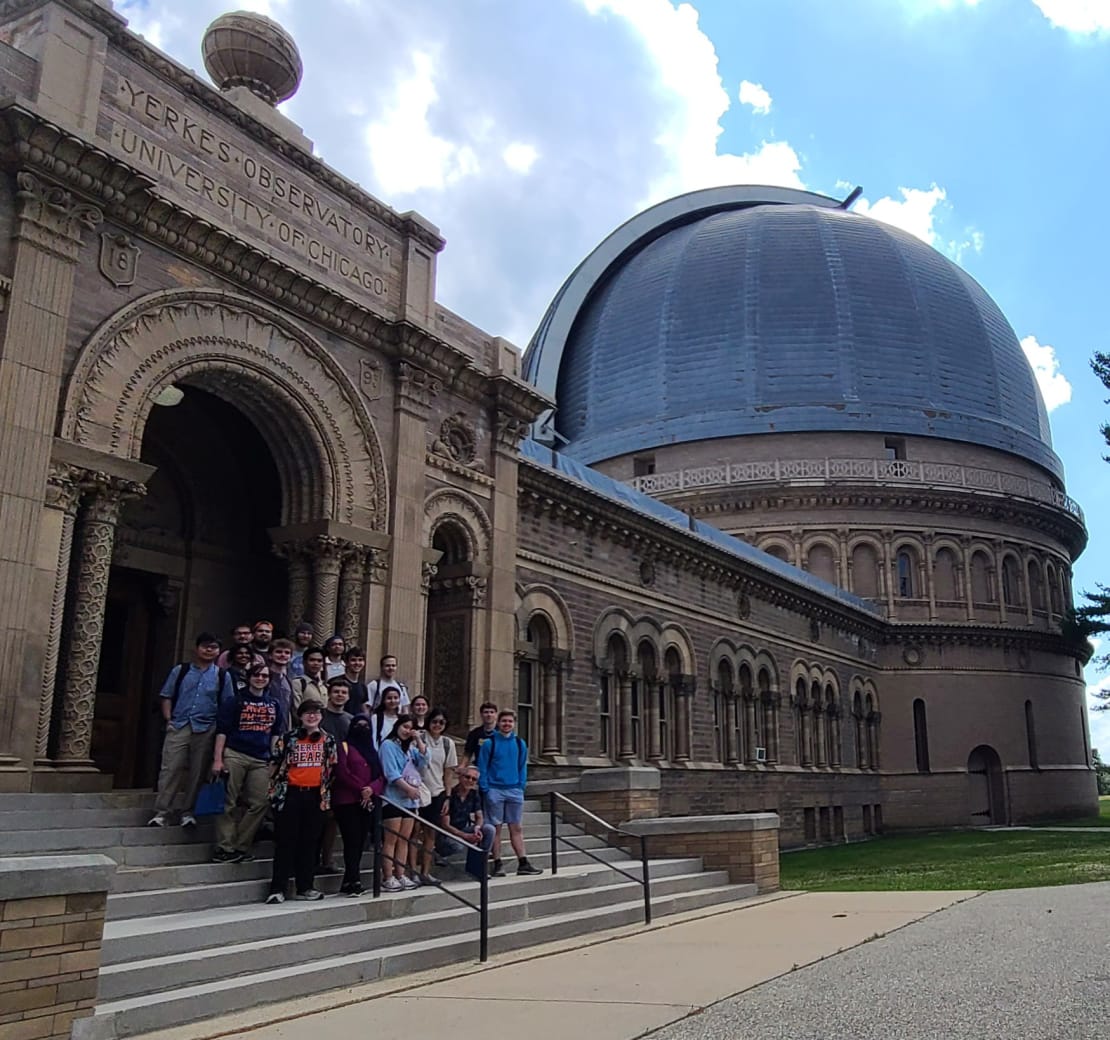 A group of people posing in front of the Yerkes Observatory