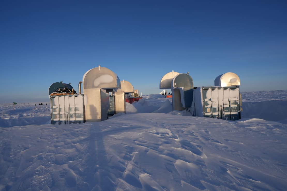 IceCube Upgrade drill camp structures seen at early sunrise, a bit frosty.