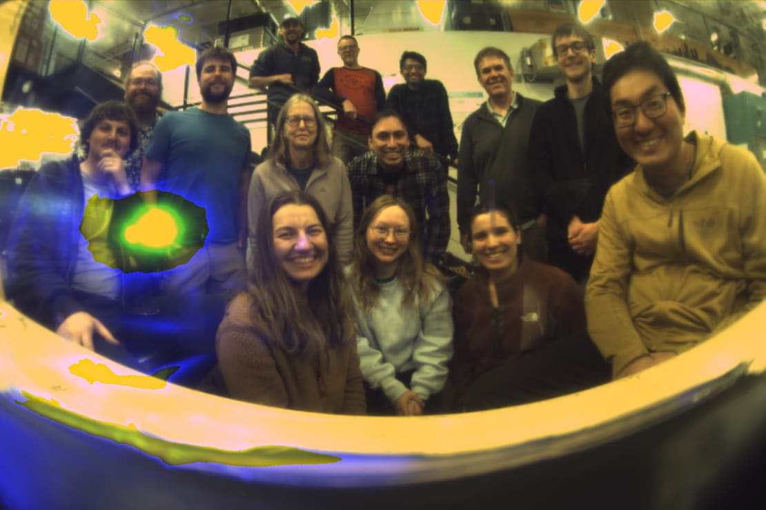 Group photo taken from the camera inside an IceCube Upgrade sensor module.