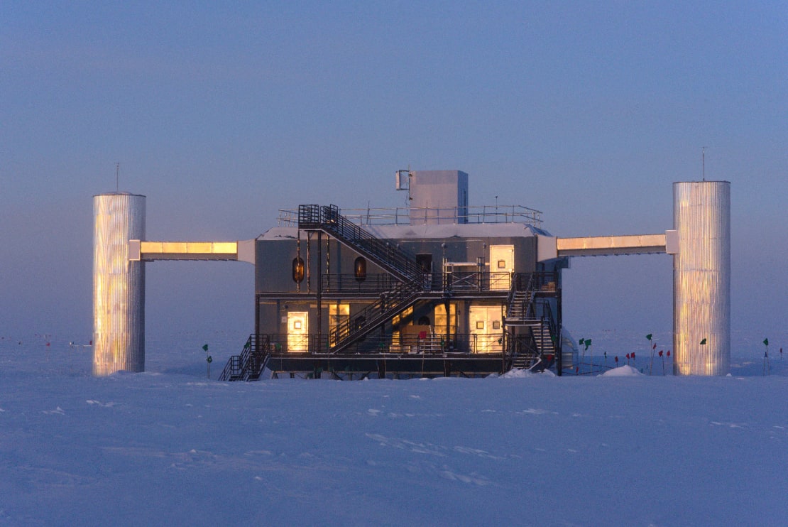 The face of the IceCube Laboratory bathed in light at late sunset.
