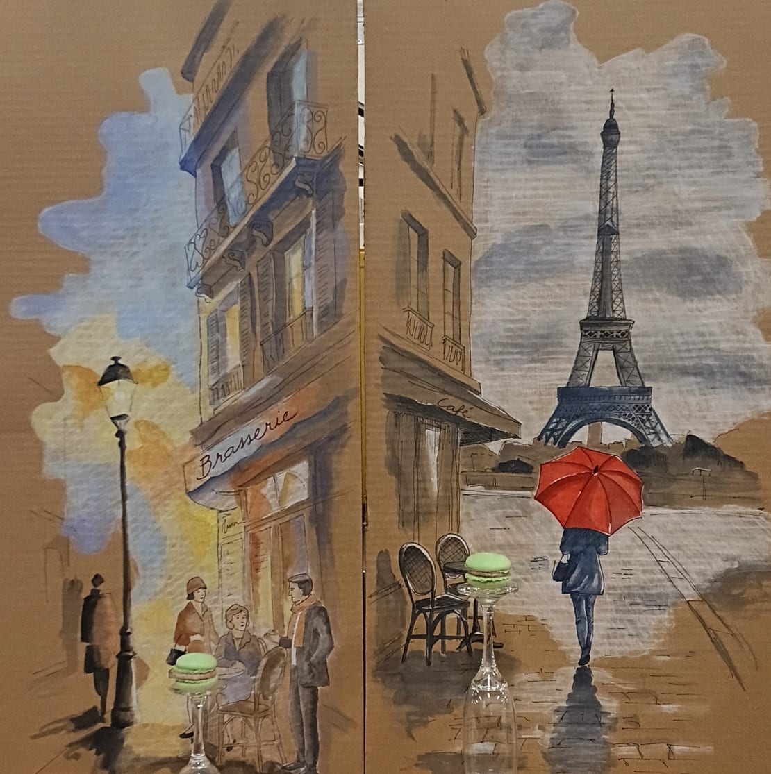 Two vertical paintings on cardboard panels of Parisian scenes with macarons on “pedestals” positioned so as to appear part of paintings.