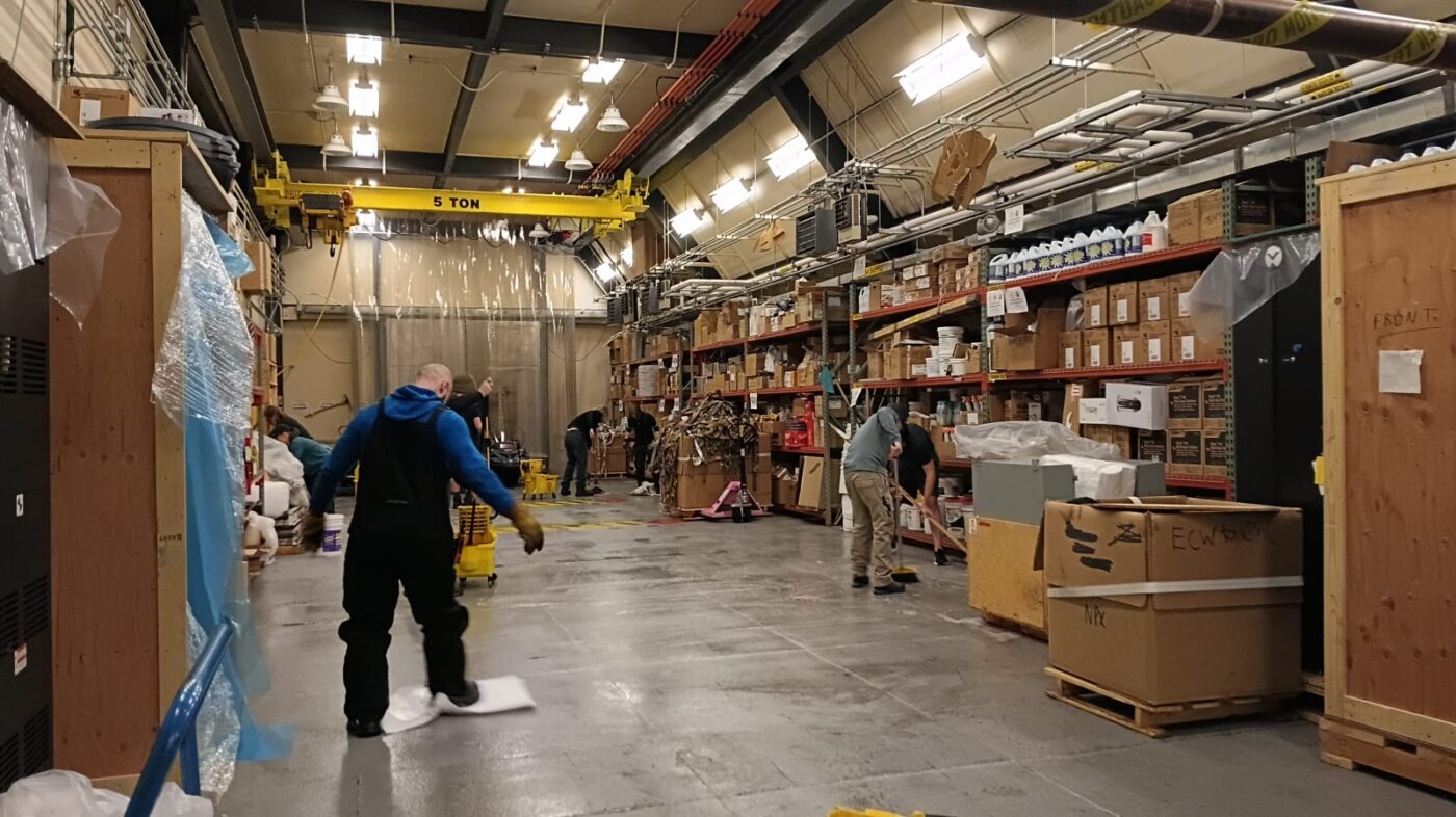 Several people working in warehouse garage