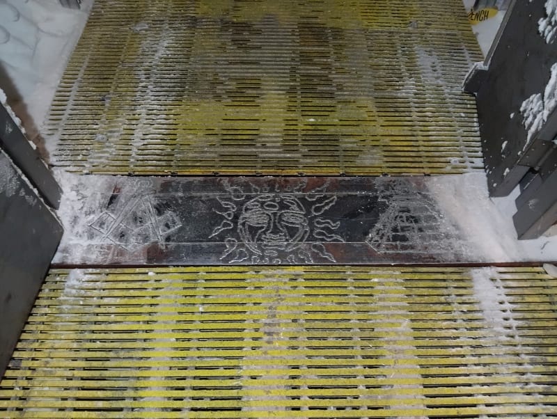 Etched street art on the floor connecting underground arches at the South Pole.