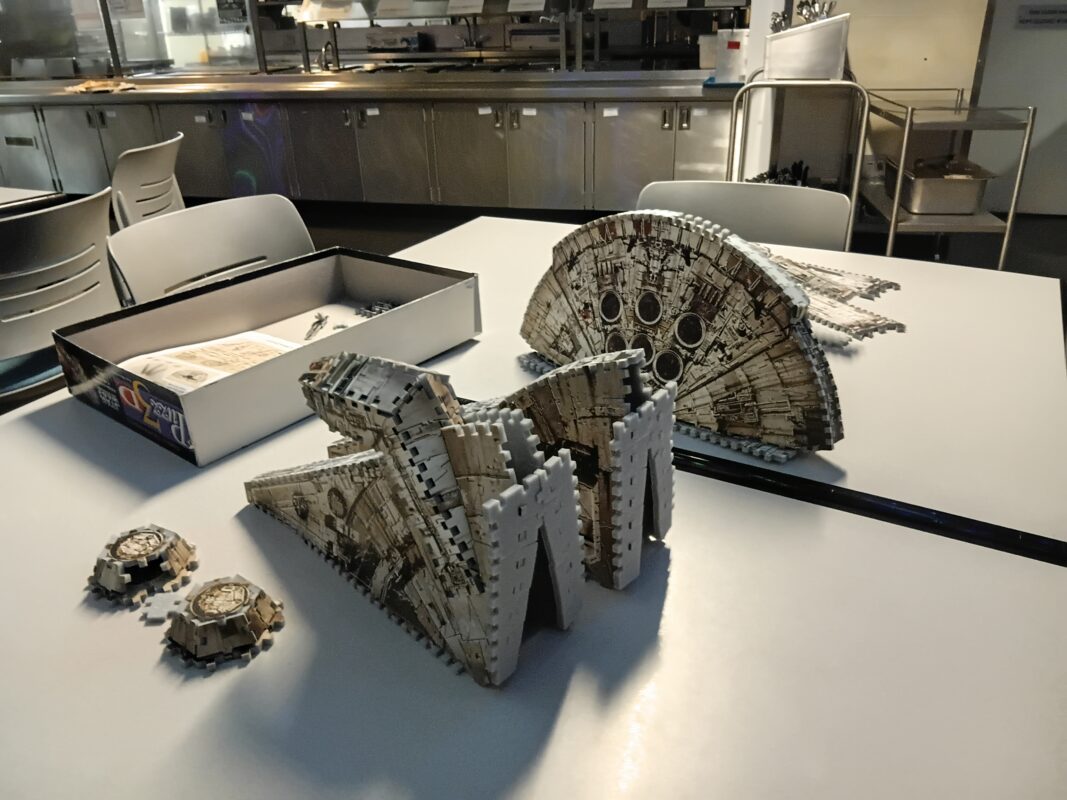 Close-up of nearly complete 3D puzzle of the Millenium Falcon from Star Wars.