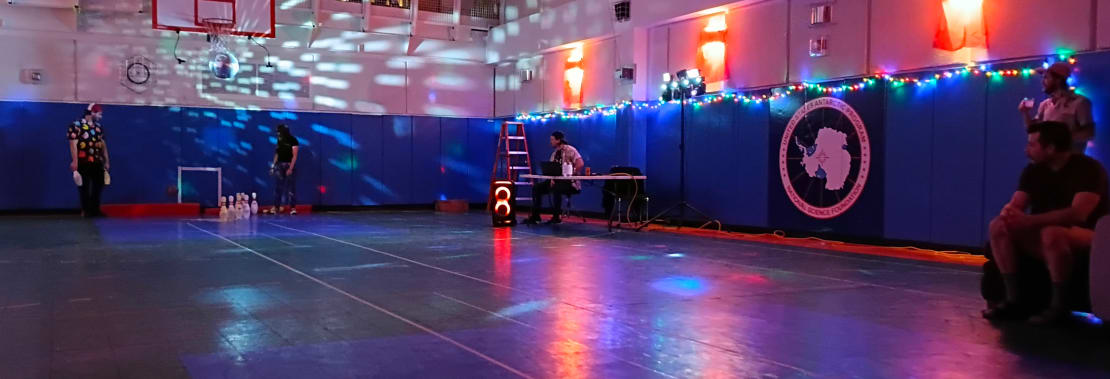 View of gym under disco lights.