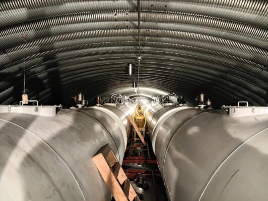 Long view of large fuel tanks in the underground arch at the South Pole