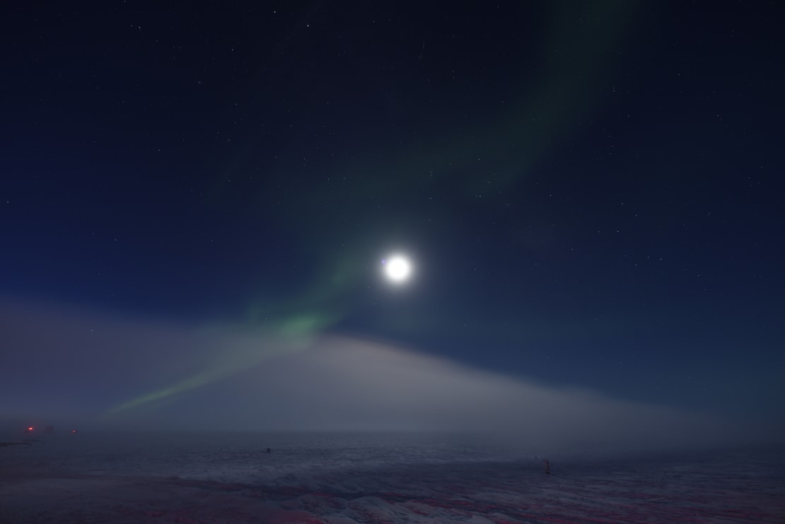Bright moon with some wispy auroras.