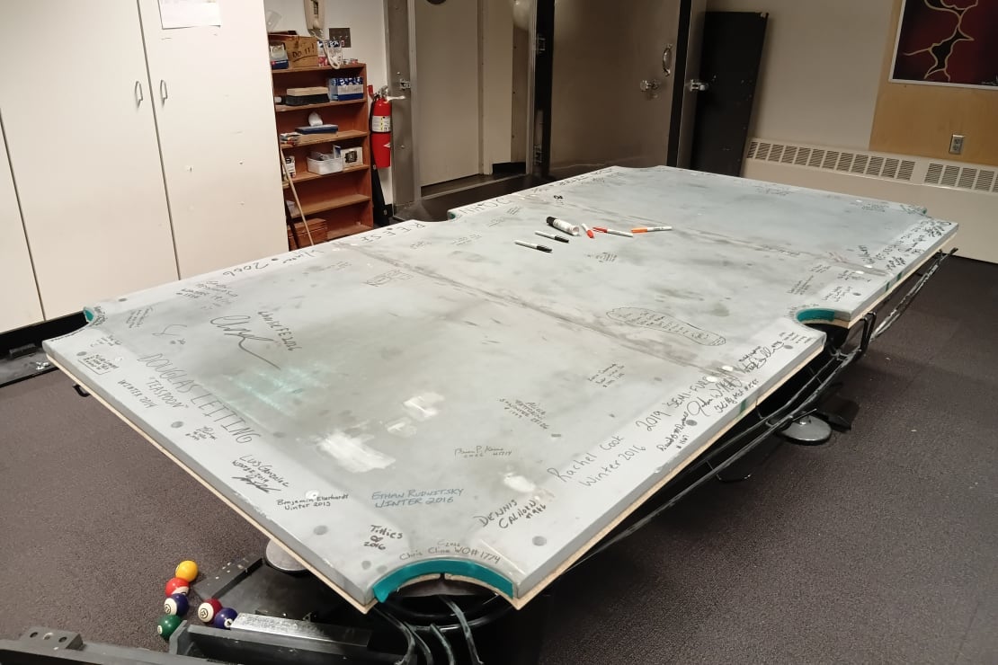 Pool table shown stripped of fabric topping.