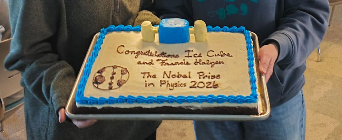 Close-up on a sheet cake decorated with a Nobel Prize congratulatory message.
