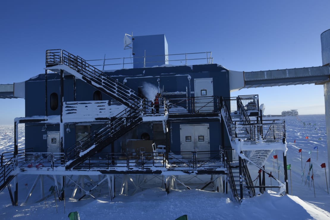 The IceCube Lab after some major snow removal from its staircases at sunrise.